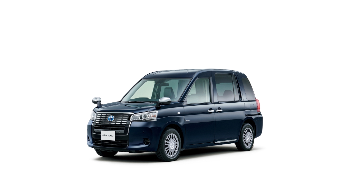 A black, Hybrid Electric JPN Taxi, resembling a small SUV crossed with a van. Designed for accessibility, with children, the elderly and wheelchair users in mind.