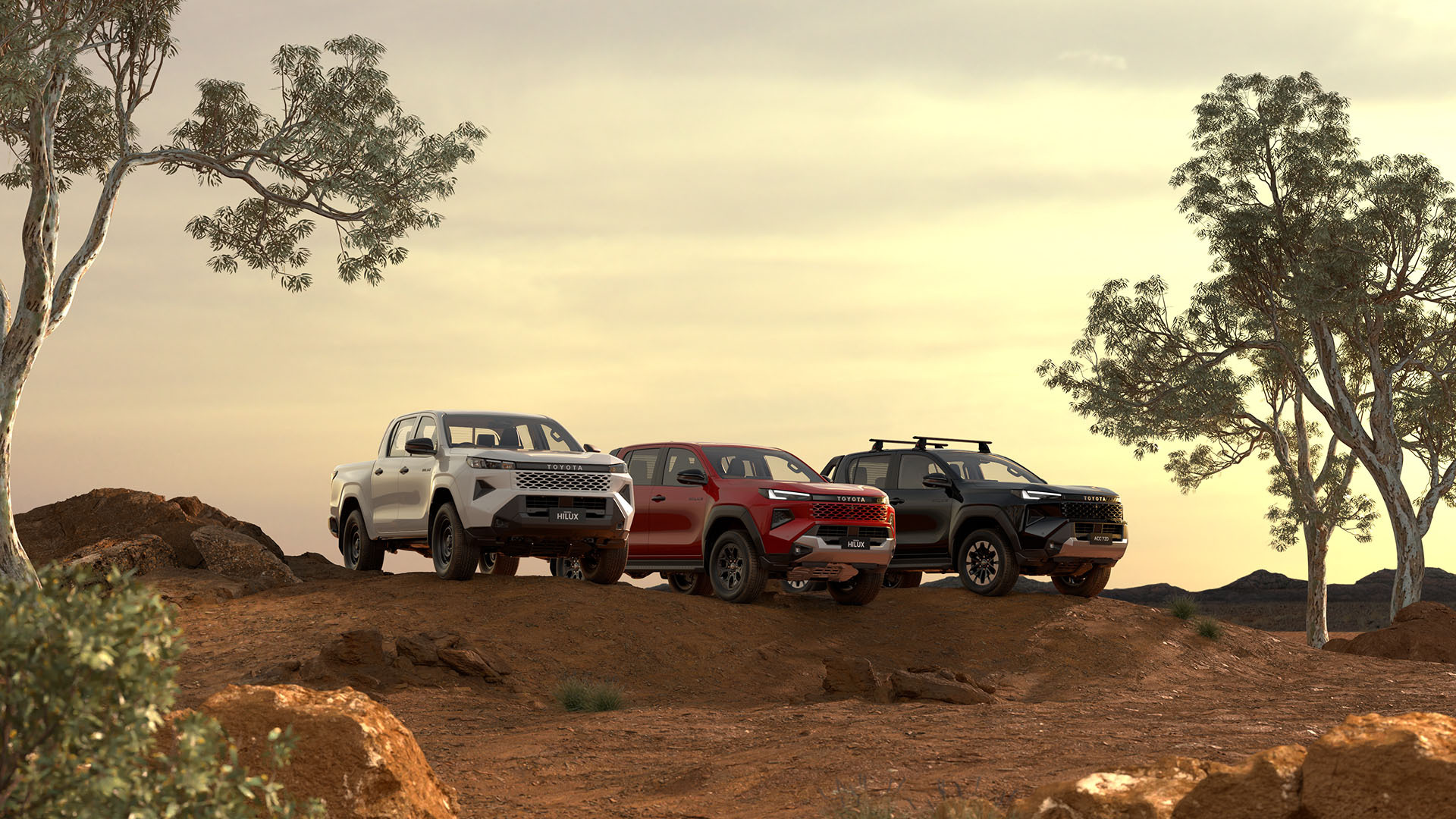 Three HiLux double-cab utes sit parked in a dirt clearing at golden hour. The first has Glacier White paint, the middle one is Feverish Red and the end one is Ash Slate. Australian trees and scrub frame the scene, while the sun sets behind them. 