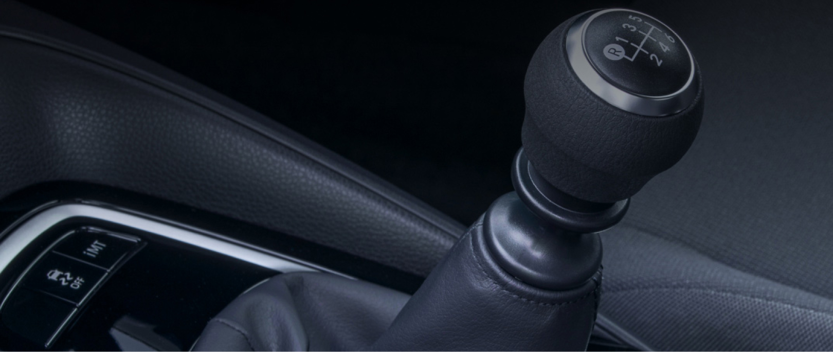 The close up of a black Toyota gearstick.