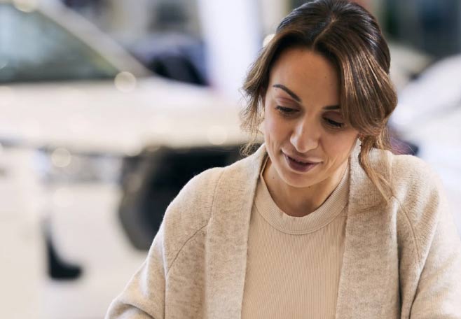 woman looking over paperwork