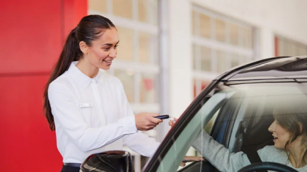 Toyota Dealer handing over keys to buyer